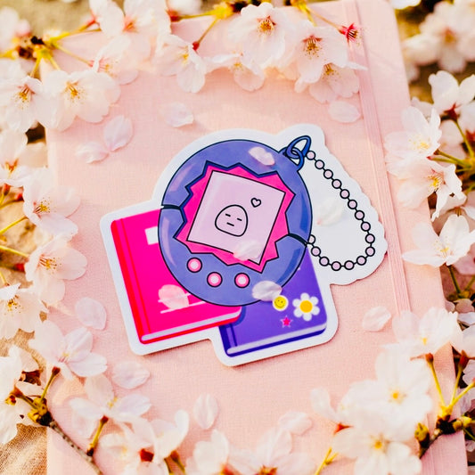 Tamagotchi Books Kawaii Glossy Vinyl Sticker | Waterproof 2.5" Cute Aesthetic Decal for Water Bottles, Laptops, & Journals